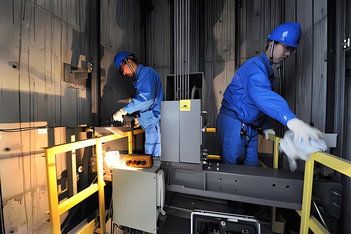 Engineer performing elevator maintenance